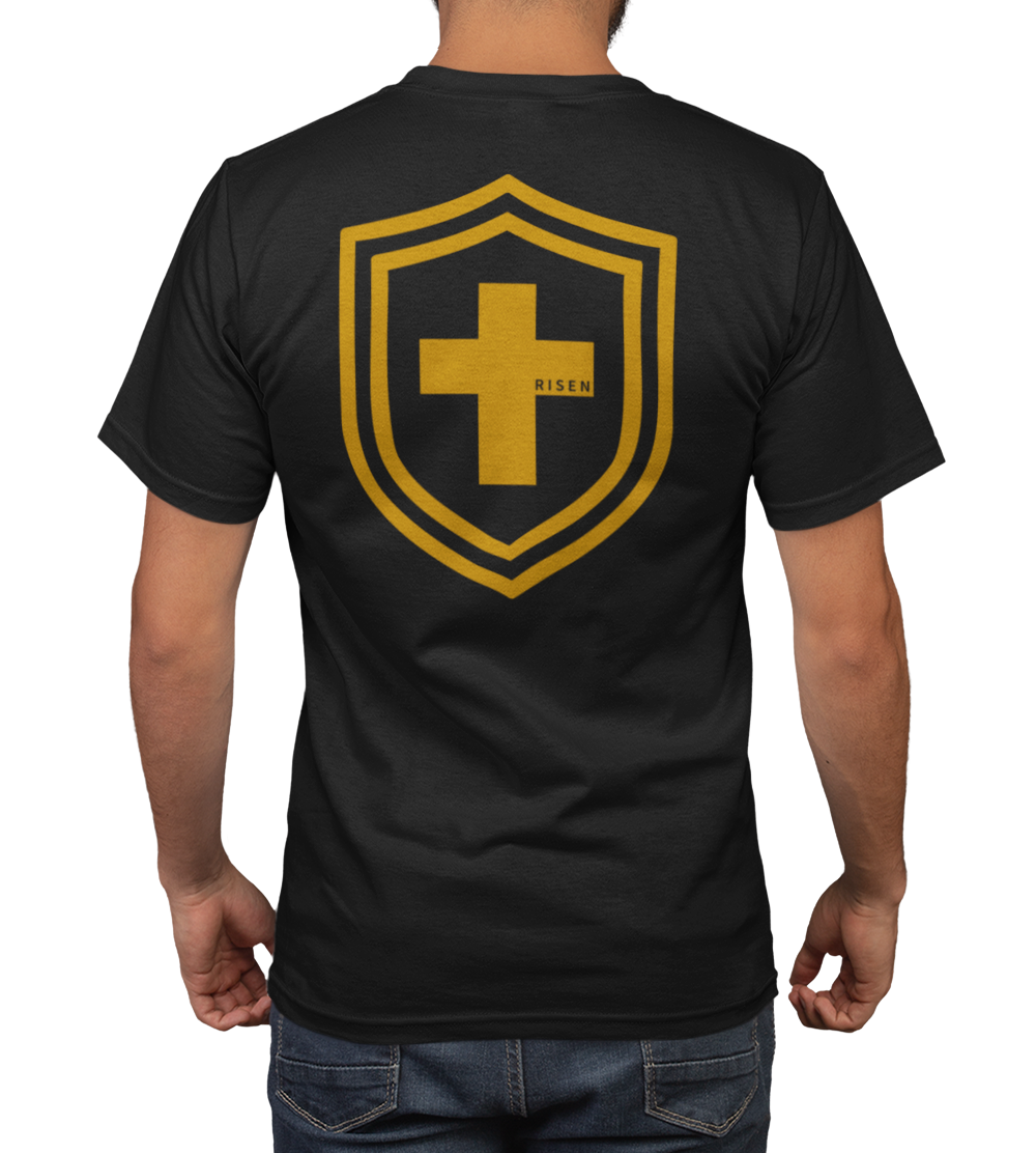 Back view of a men's t-shirt featuring a shield design with a yellow cross and 'RISEN' lettering.