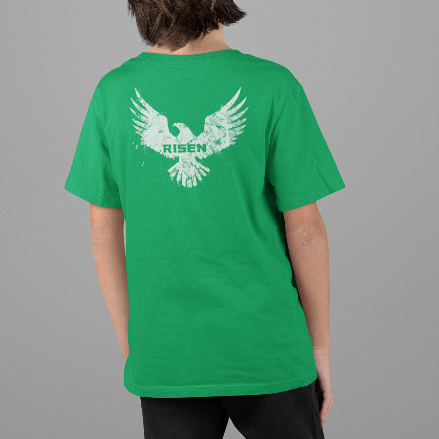 Born to Rise Youth Christian T-Shirt featuring RISEN Eagle graphic on a green background.
