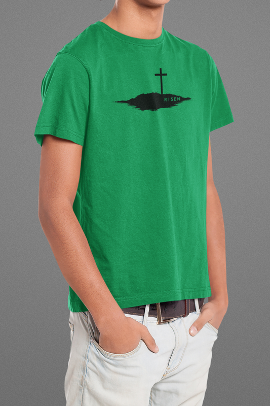 Youth Unmoved Christian T-Shirt showcasing RISEN cross graphic on a green tee, perfect for young believers.