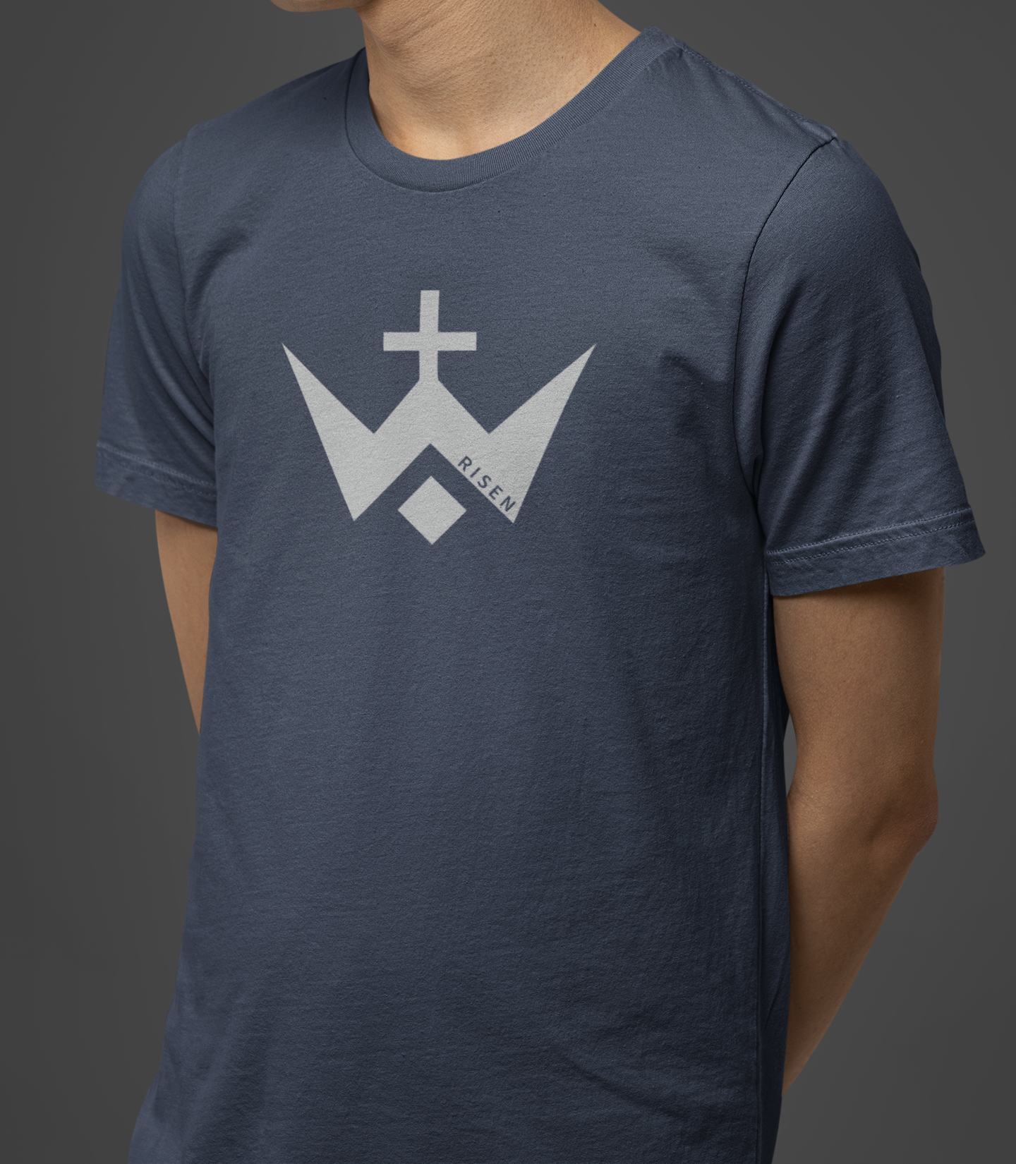 Worthy Men’s Cross T-Shirt featuring RISEN logo on a navy sueded jersey fabric background.