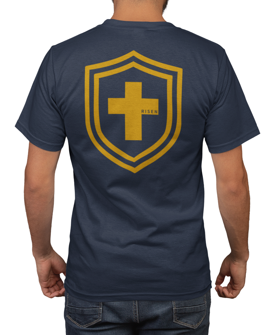 Men's Tshirt featuring a gold shield with a cross and the word 'RISEN' on the back, navy blue crew neck design.