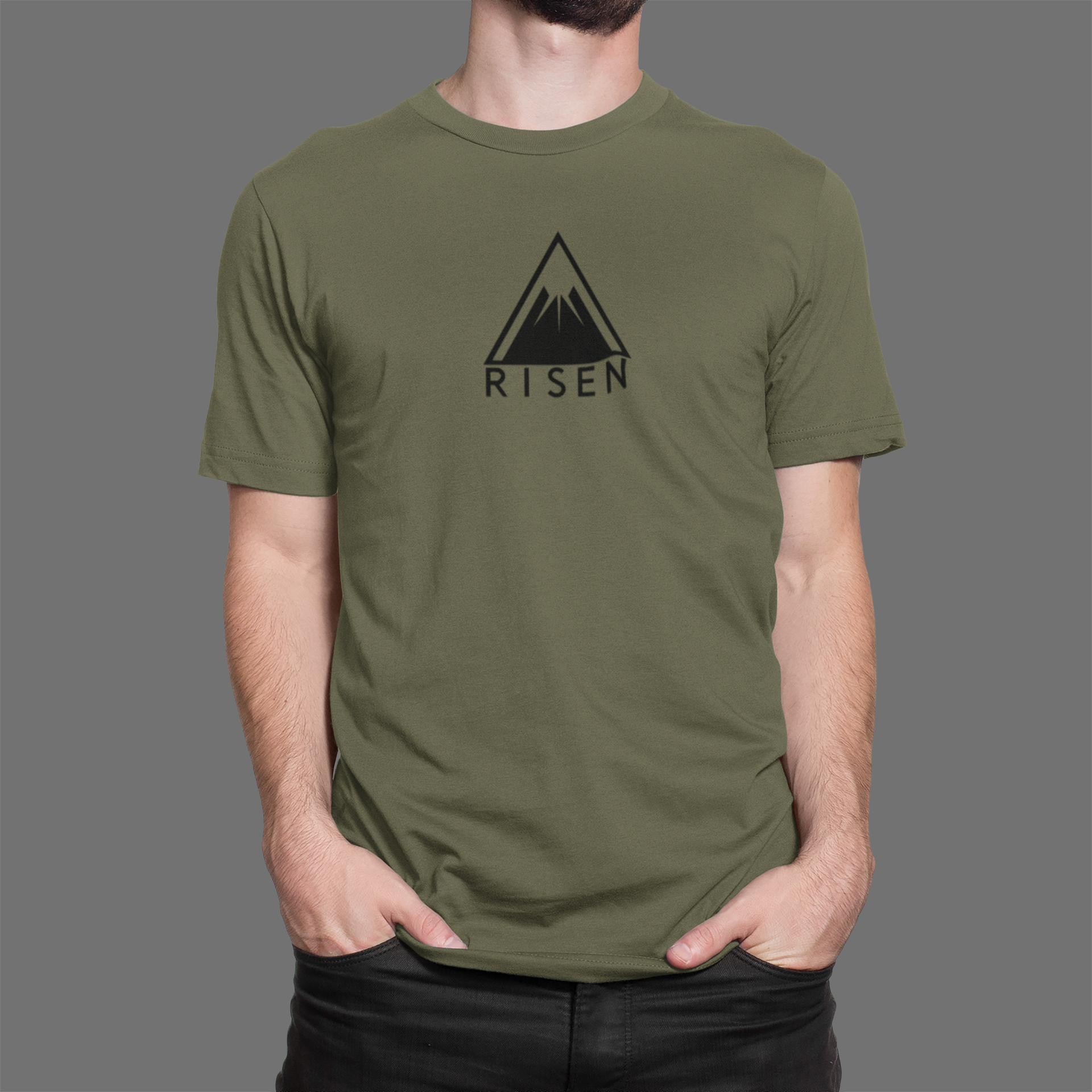 The Peak Men’s Christian T-Shirt featuring RISEN mountain graphic on a man wearing an olive green tee.