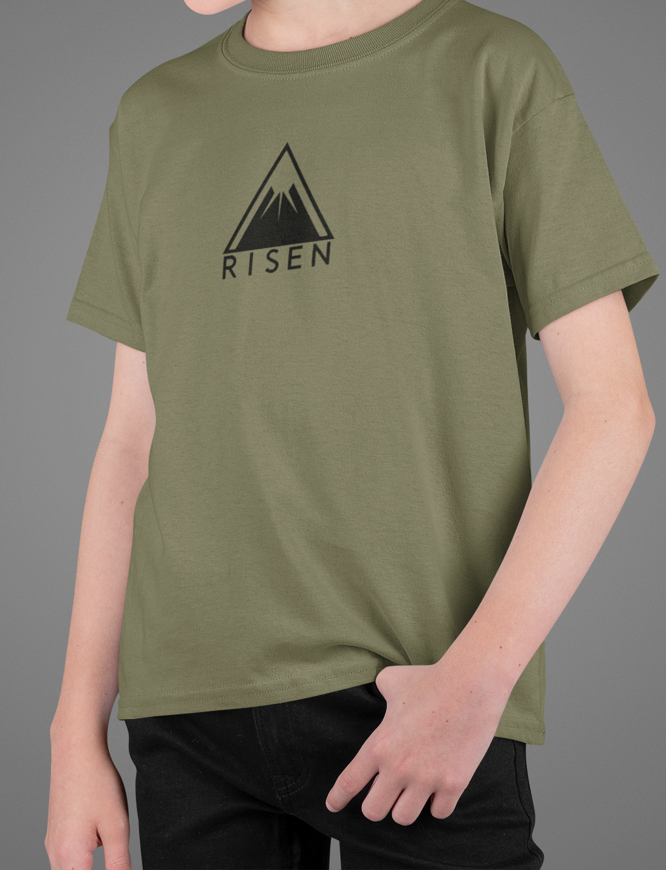 Youth The Peak Christian T-Shirt - RISEN Mountain Graphic Tee on a model, showcasing the clean mountain emblem.
