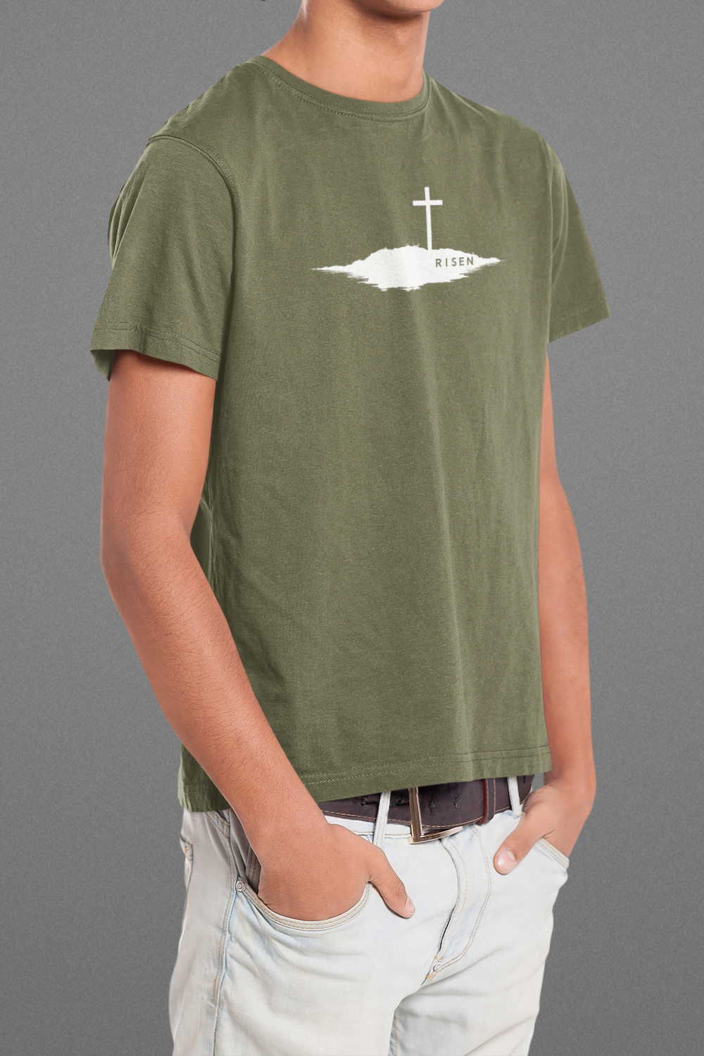 Youth Unmoved Christian T-Shirt featuring RISEN Cross graphic on olive green background.