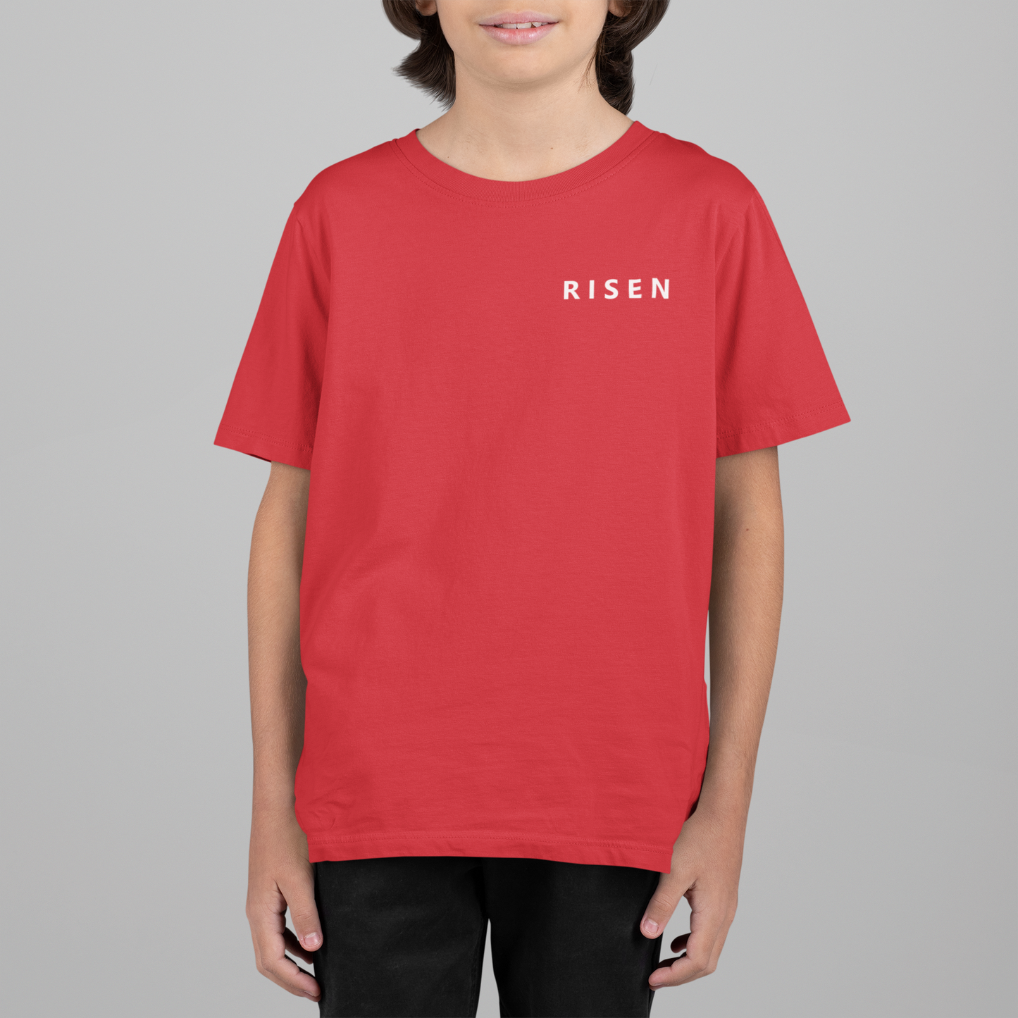 Born to Rise Youth Christian T-Shirt in red featuring RISEN text, perfect for young believers.
