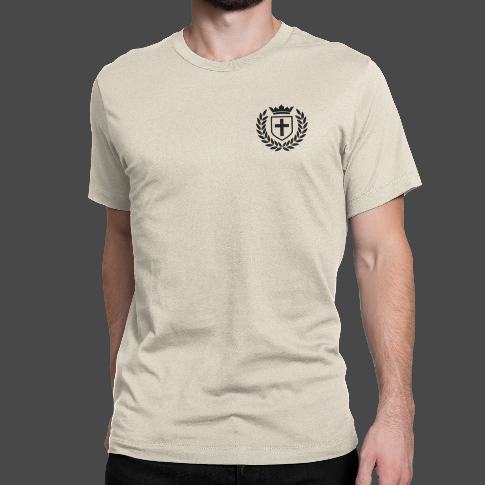 Kingdom Crest - Premium Sueded T-shirt for Men featuring a bold logo design on a beige fabric.