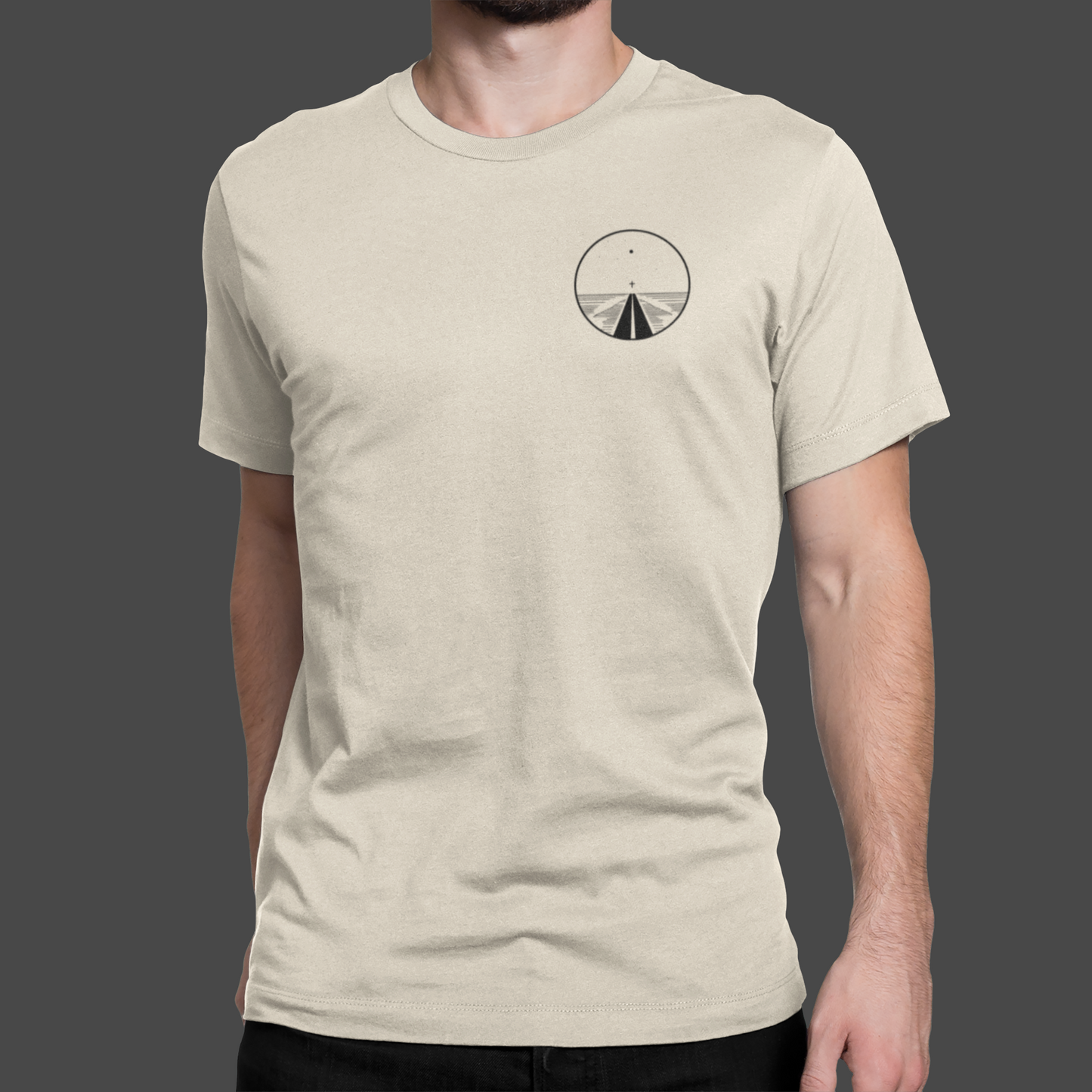 Road to Salvation - Premium Sueded Men's Shirt model wearing a cream t-shirt with a minimalist cross and pathway design.